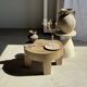 Petrified wood catchall or dish in beige with several grey spots in the centre.