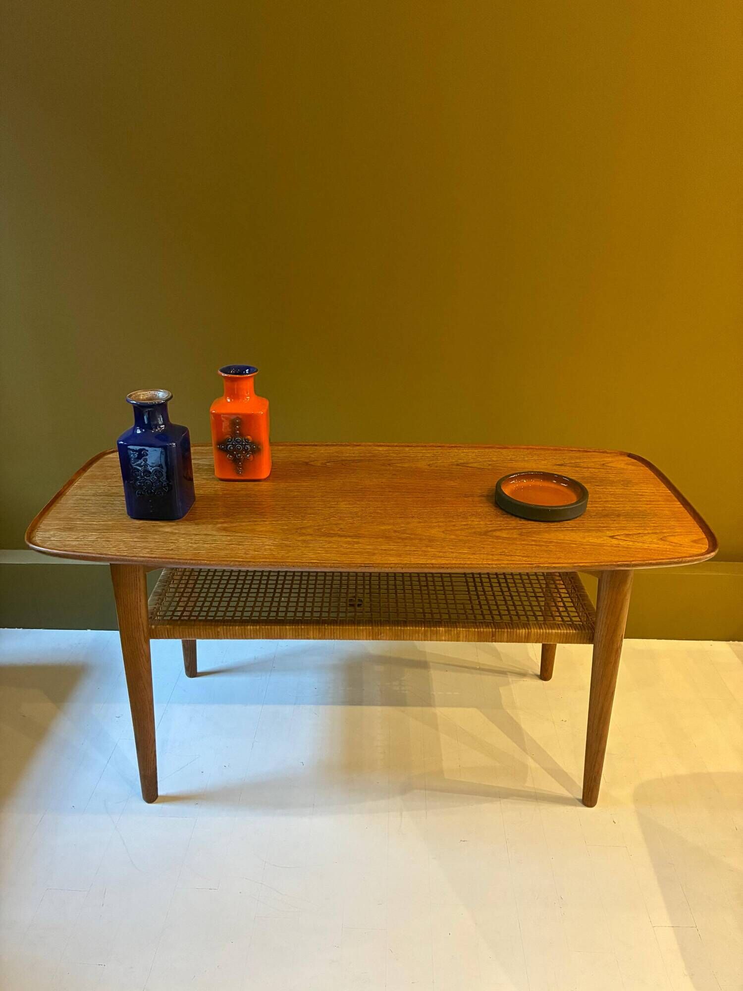 Teak and cane coffee table, 1970s.
