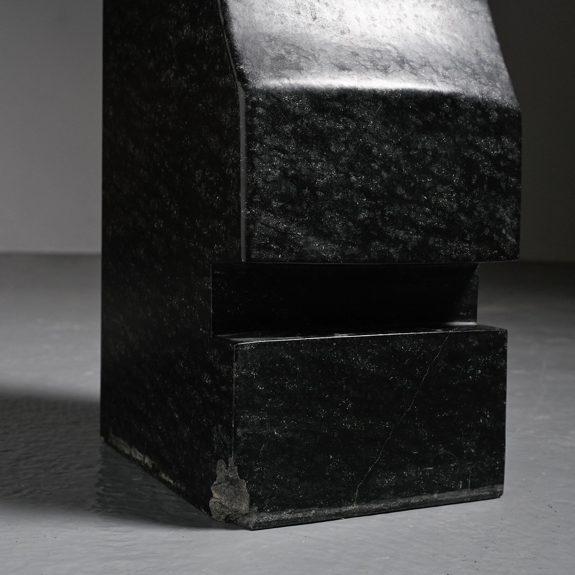 Abstract sculpture in diabase by Robert Neuhauser, Switzerland, circa 1985.