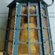 Wrought iron wall lantern & amber cathedral glass