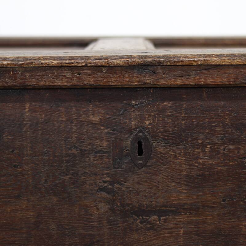 Rustic and weathered antique oak chest from the 18th century.
