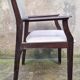 Wooden armchair and faux leather.