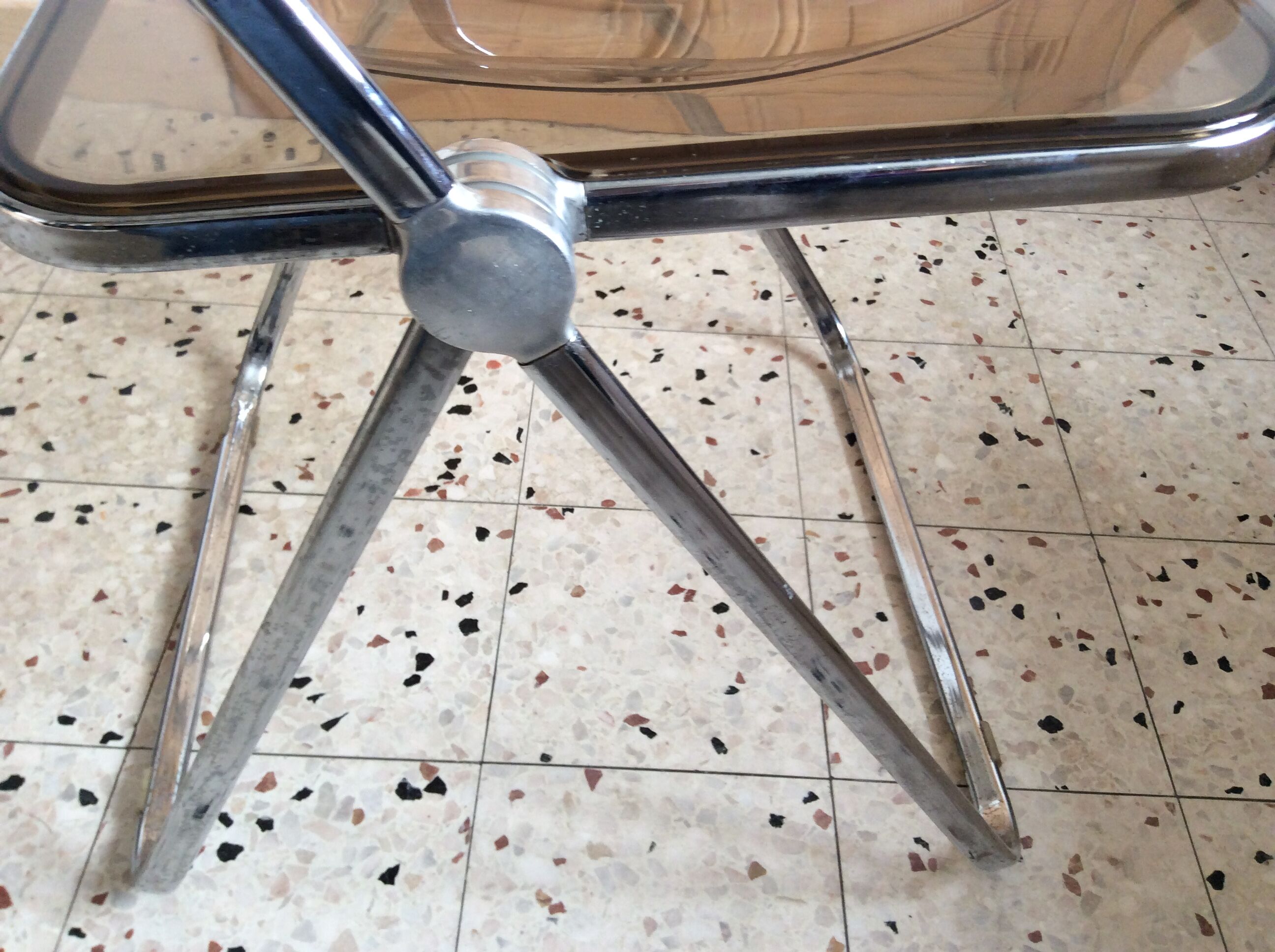 Folded chair by Giancardo Piretti for Castelli