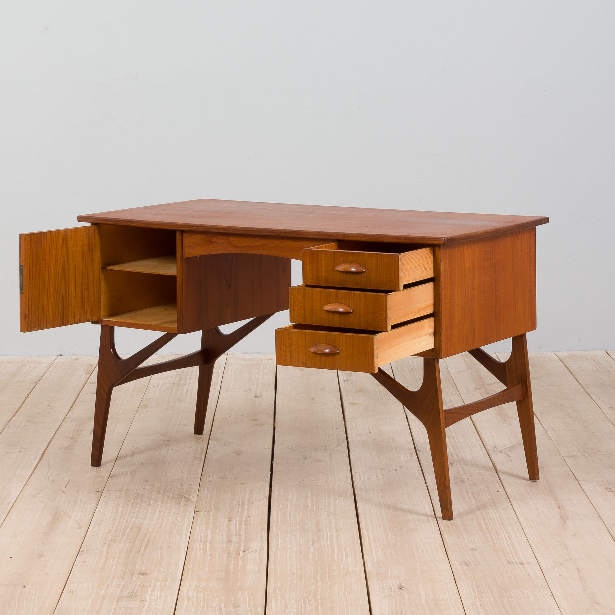 Danish mid century teak desk on sculptural base, 1960s.