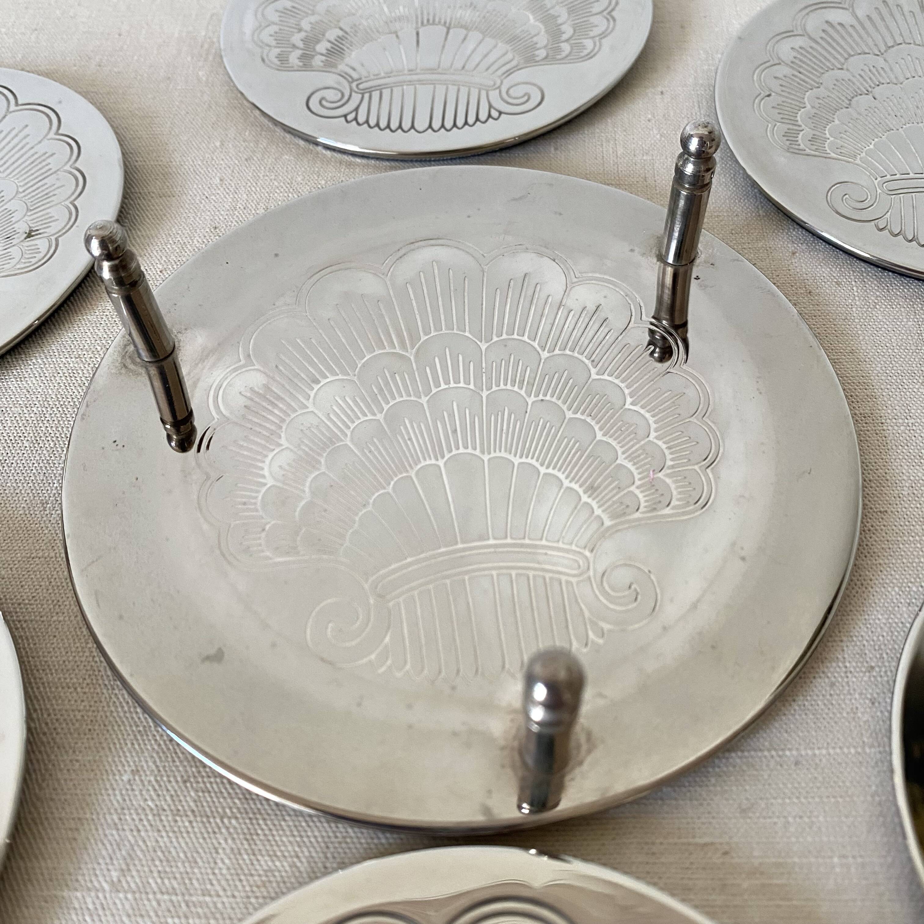 Silver coaster and holder, shell, 80s