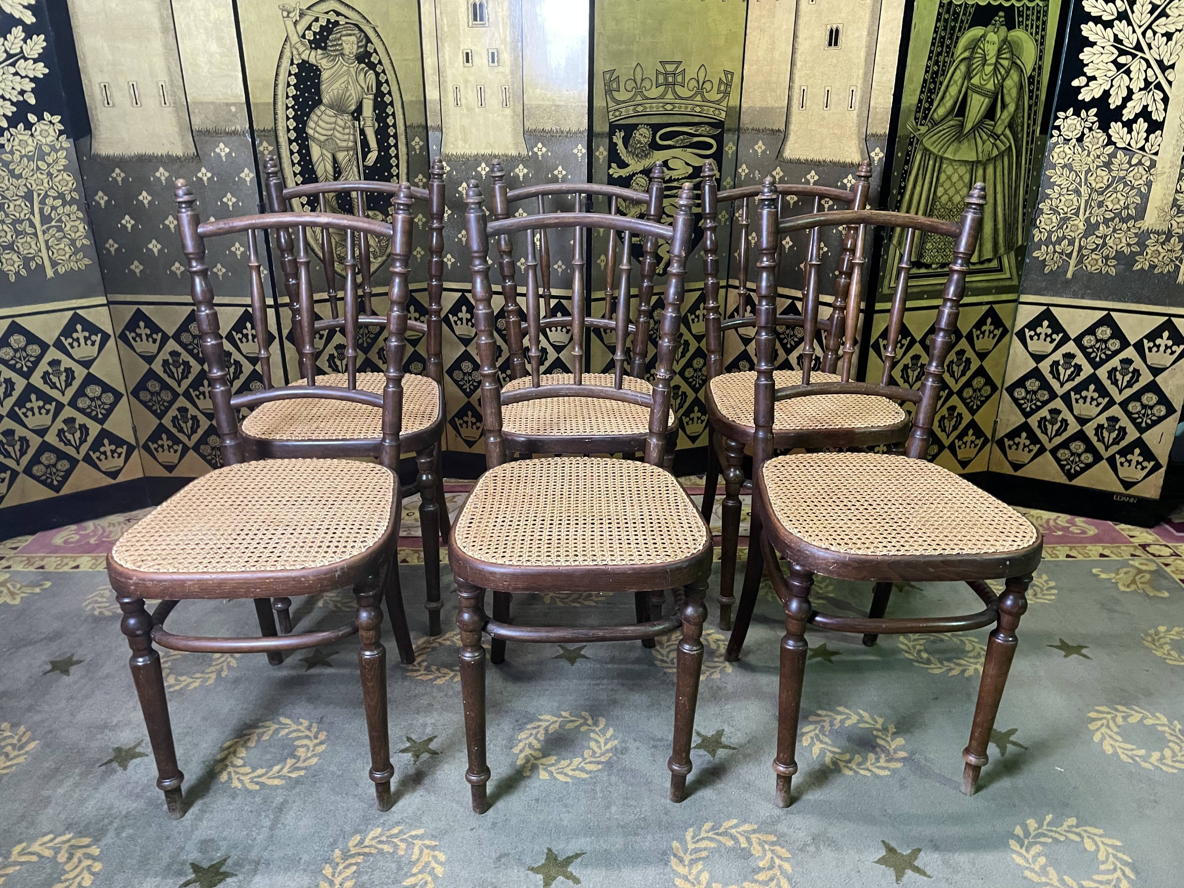 Suite de 6 chaises bistrot en cannage Fischel