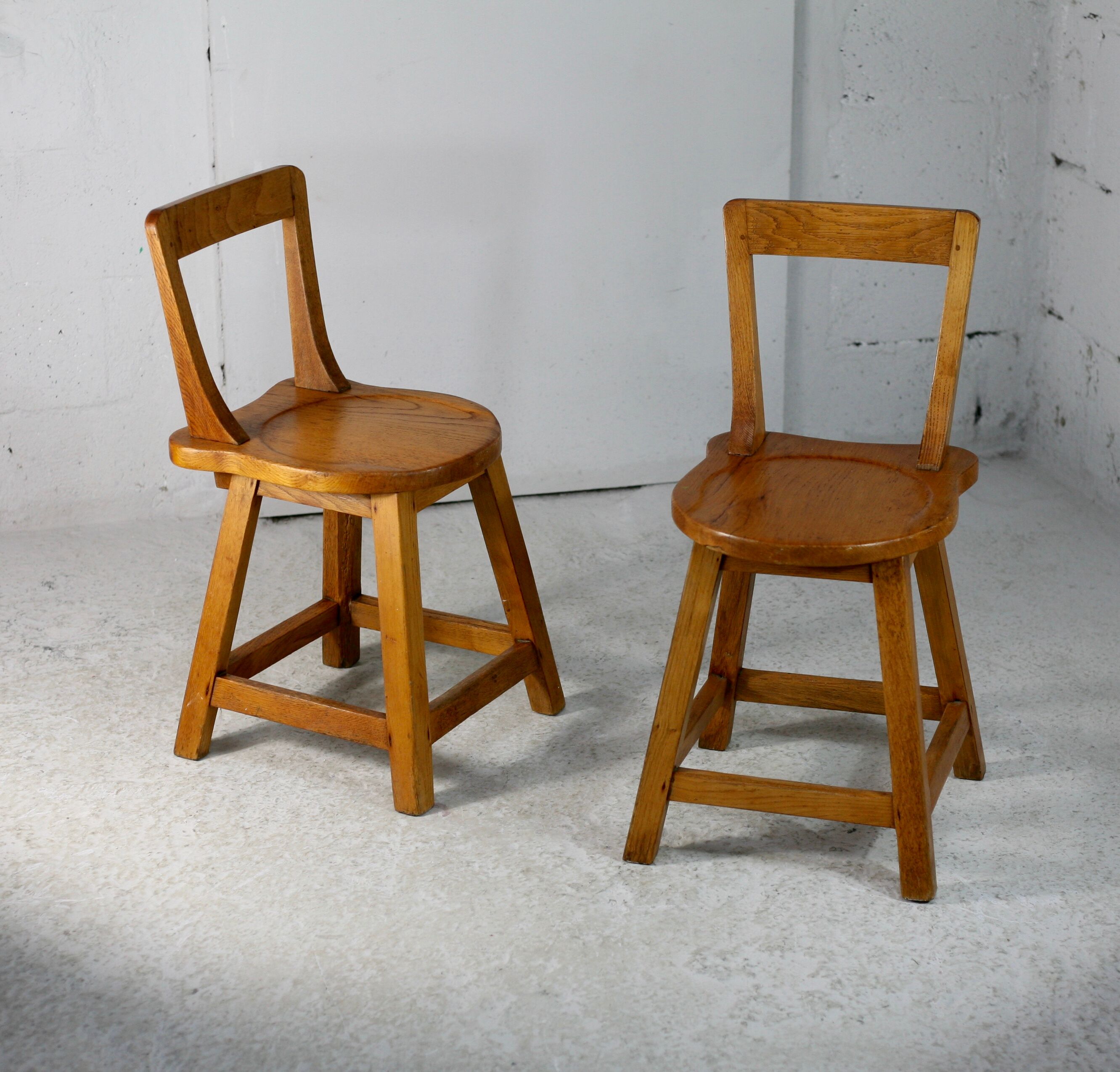 Pair of brutalist wooden back stools. France, circa 1960