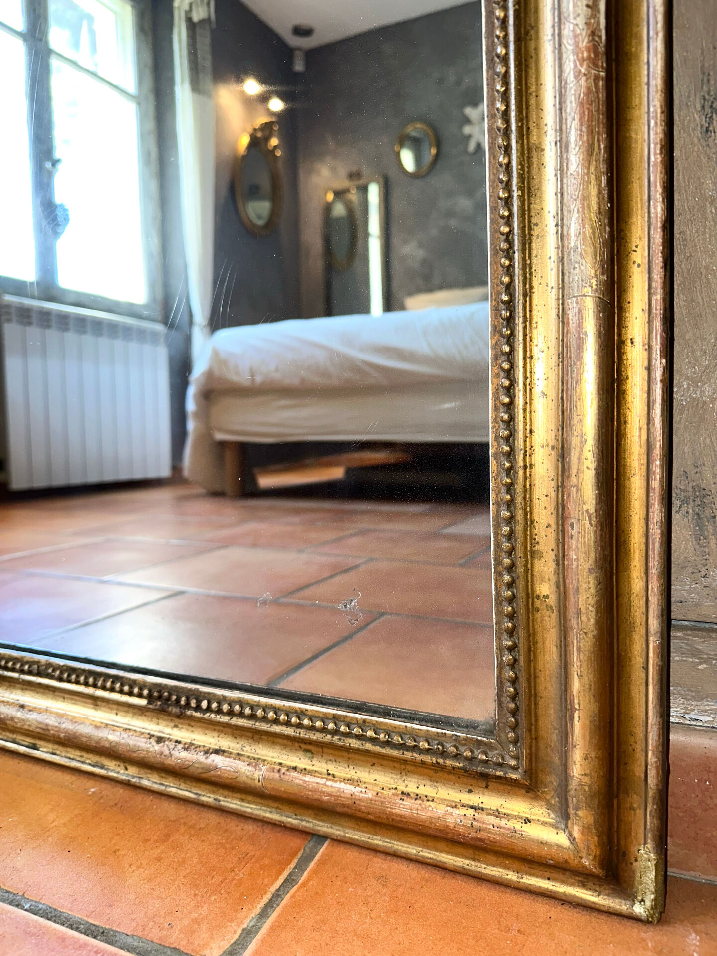 Antique Louis-Philippe gilded mirror from the 19th century.