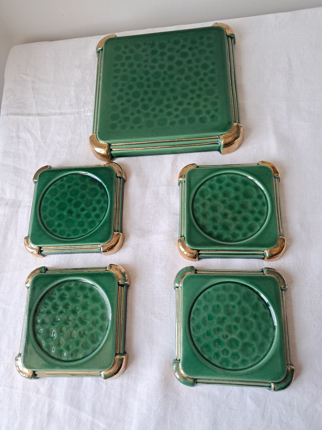 Ceramic trivets and glasses from Poët-Laval. Vintage