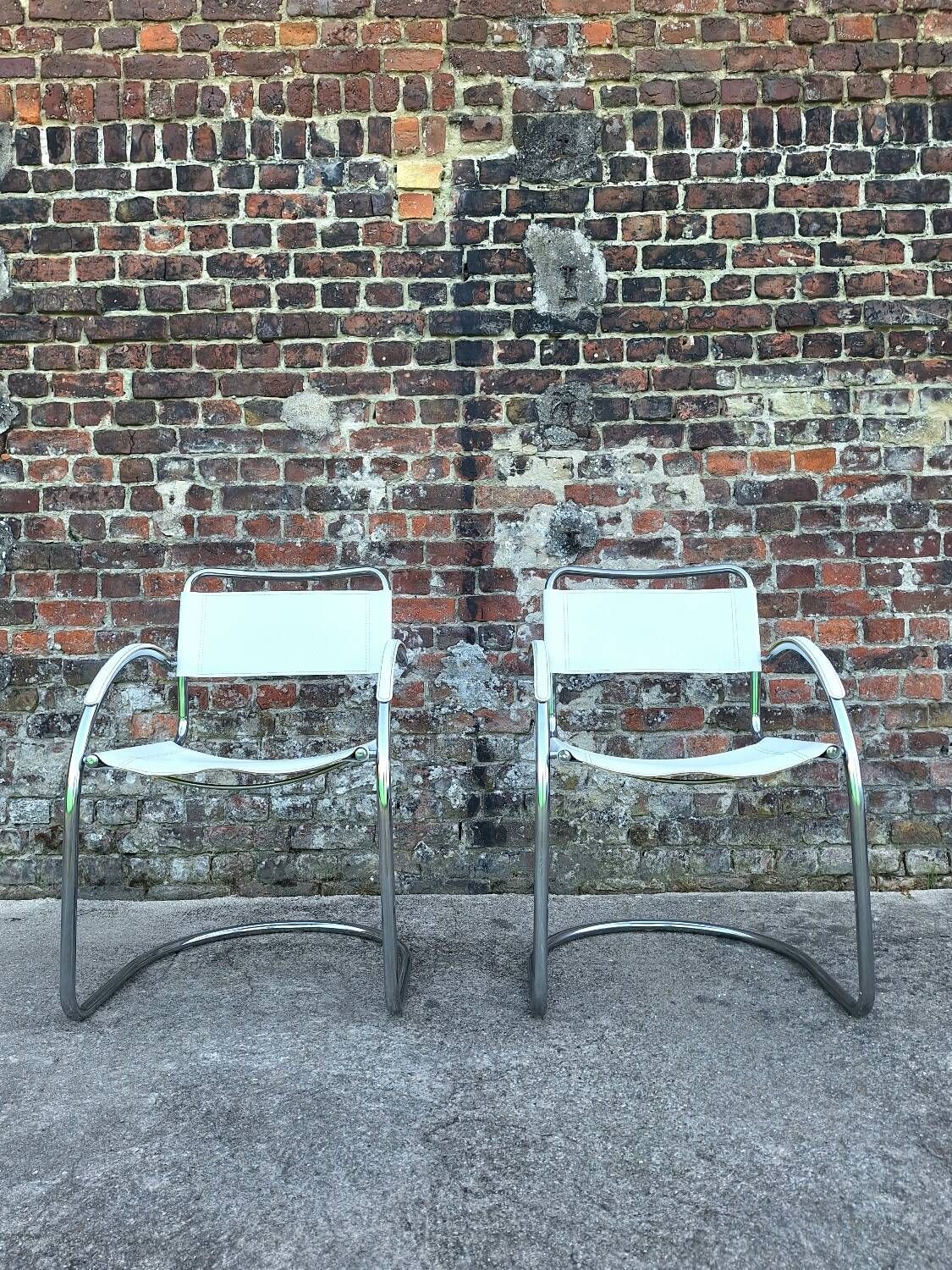 Pair of vintage tubular armchairs, designer seating furniture