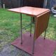 Vintage folding table with teak flaps said wallet with metal tubular base