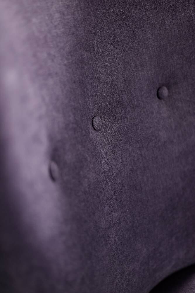 High-backed wing chair in oak and purple fabric, vintage Scandinavian style from the 1950s.