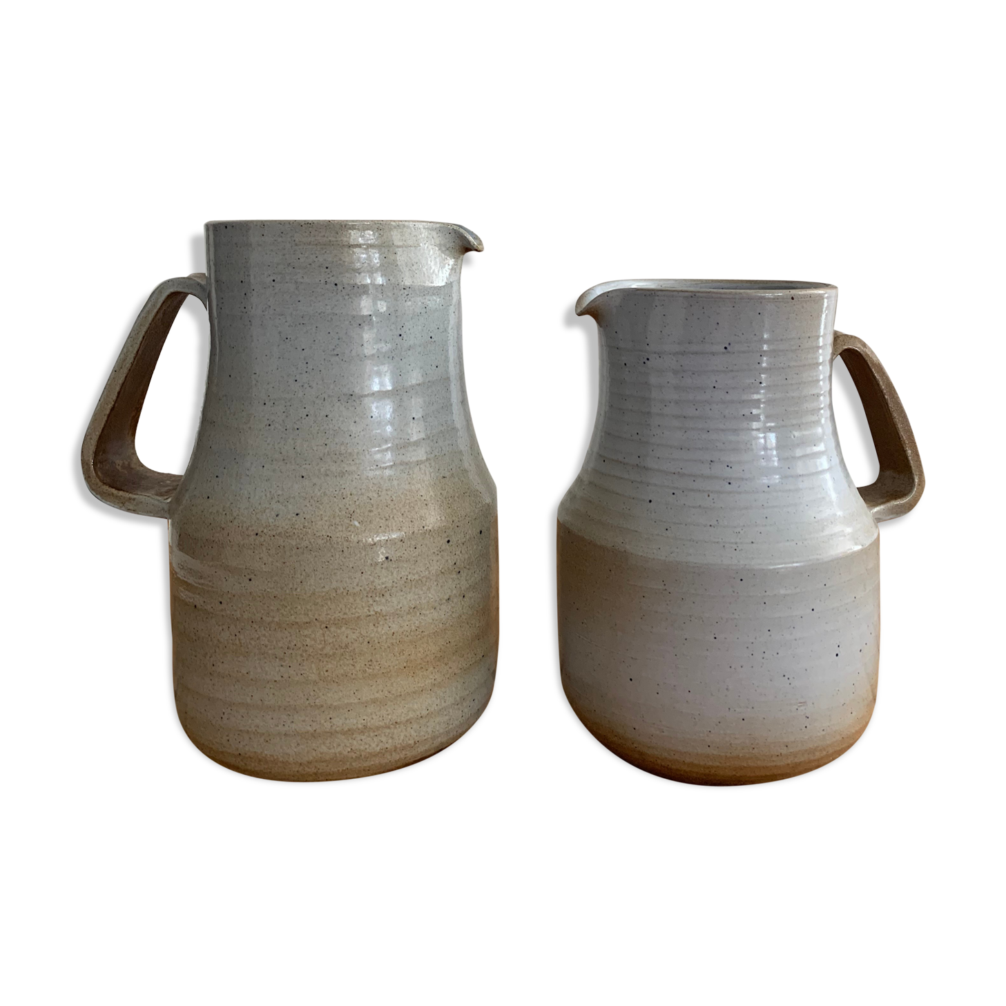 Pair vintage enamelled ceramic pitchers