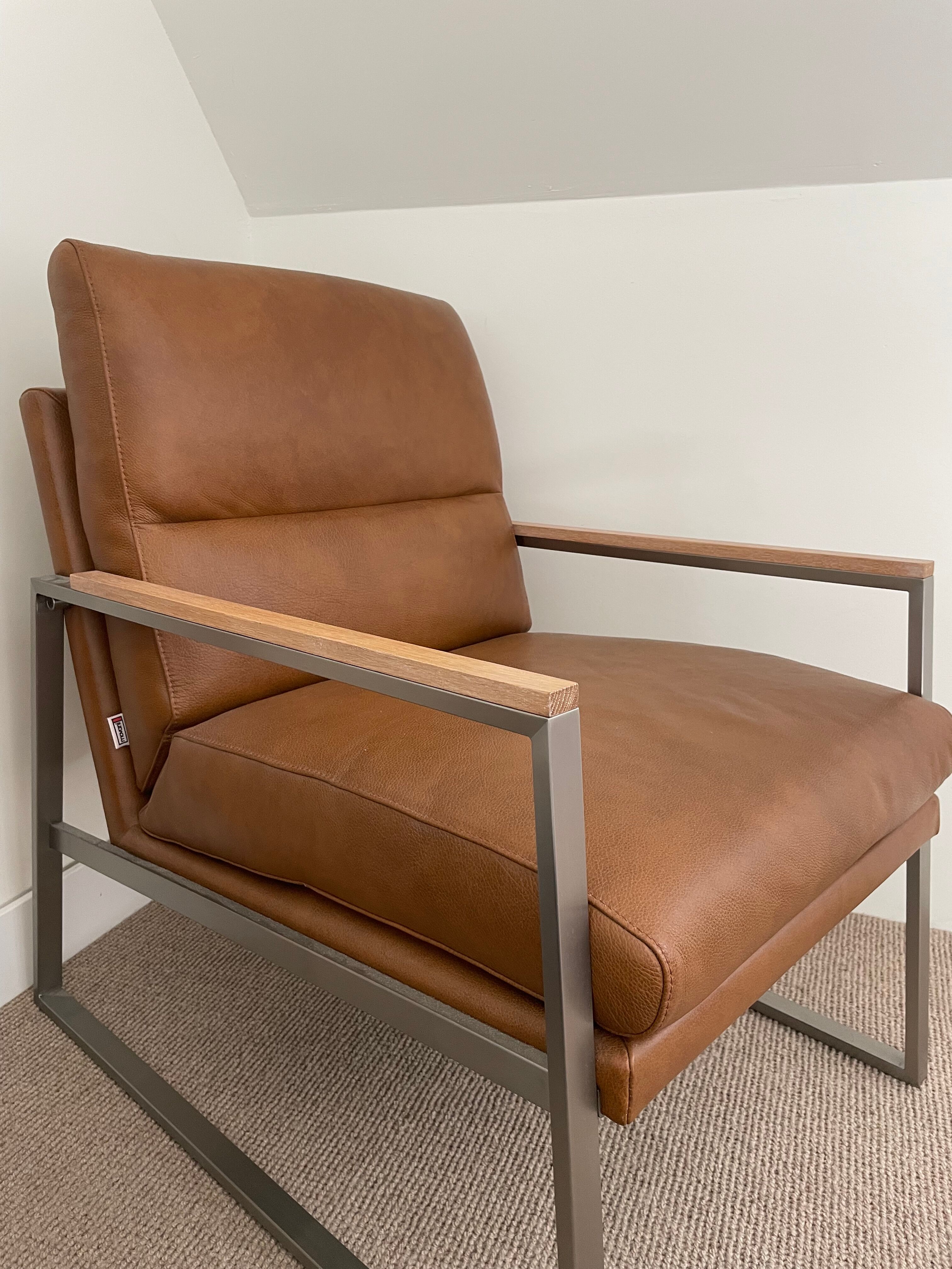 A pair genuine leather armchairs.