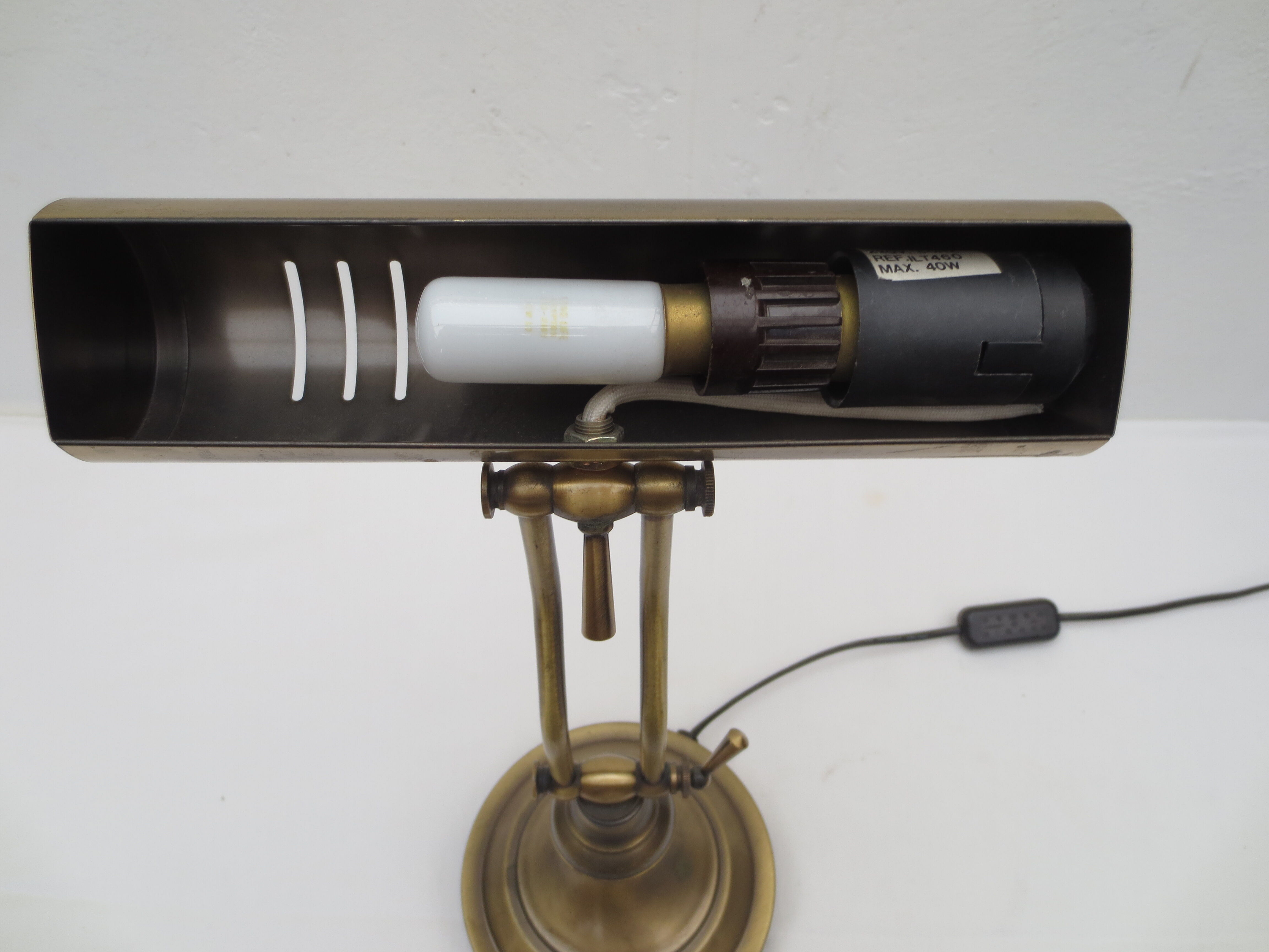 Old aged brass articulated desk lamp
