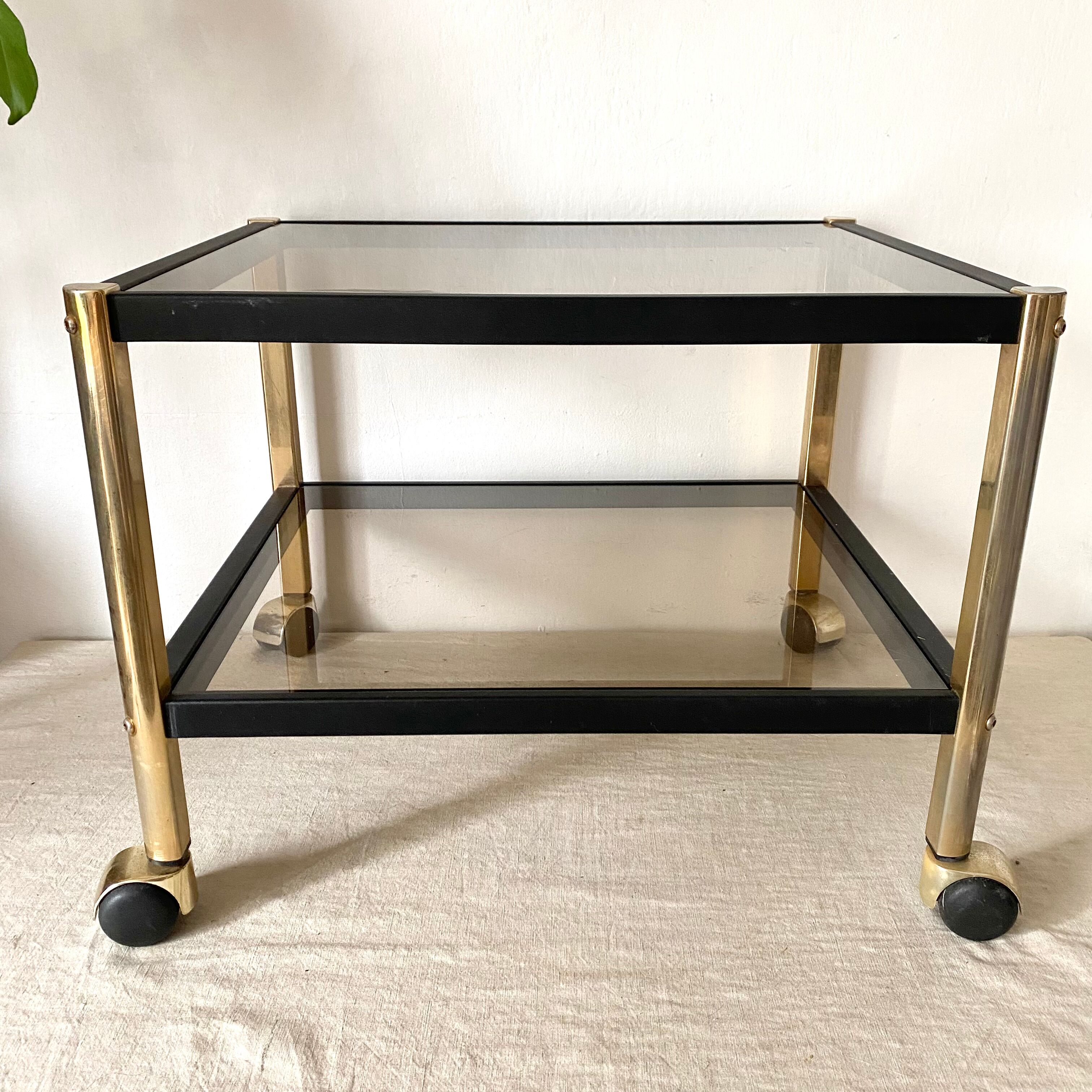 Serving with vintage wheels in metal and smoked glass