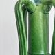 Pottery green ceramic vase with four handles.