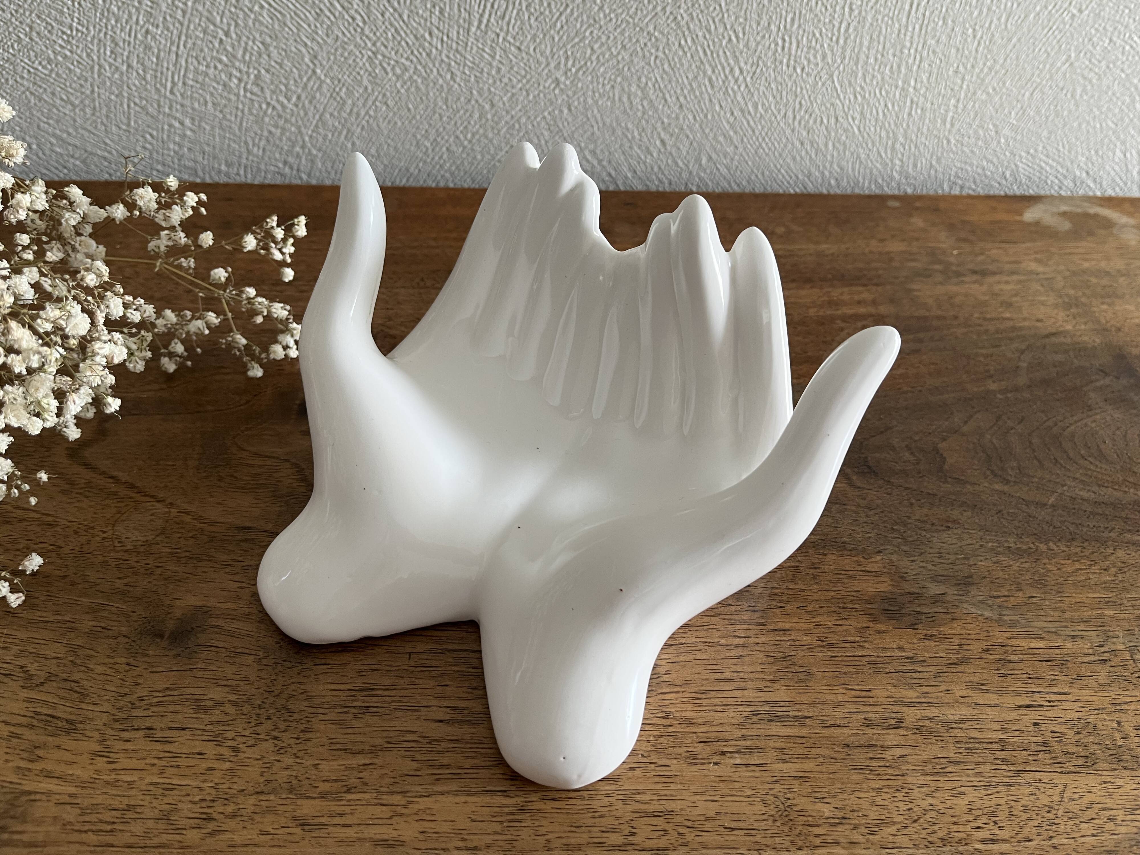 Empty white ceramic hand pocket