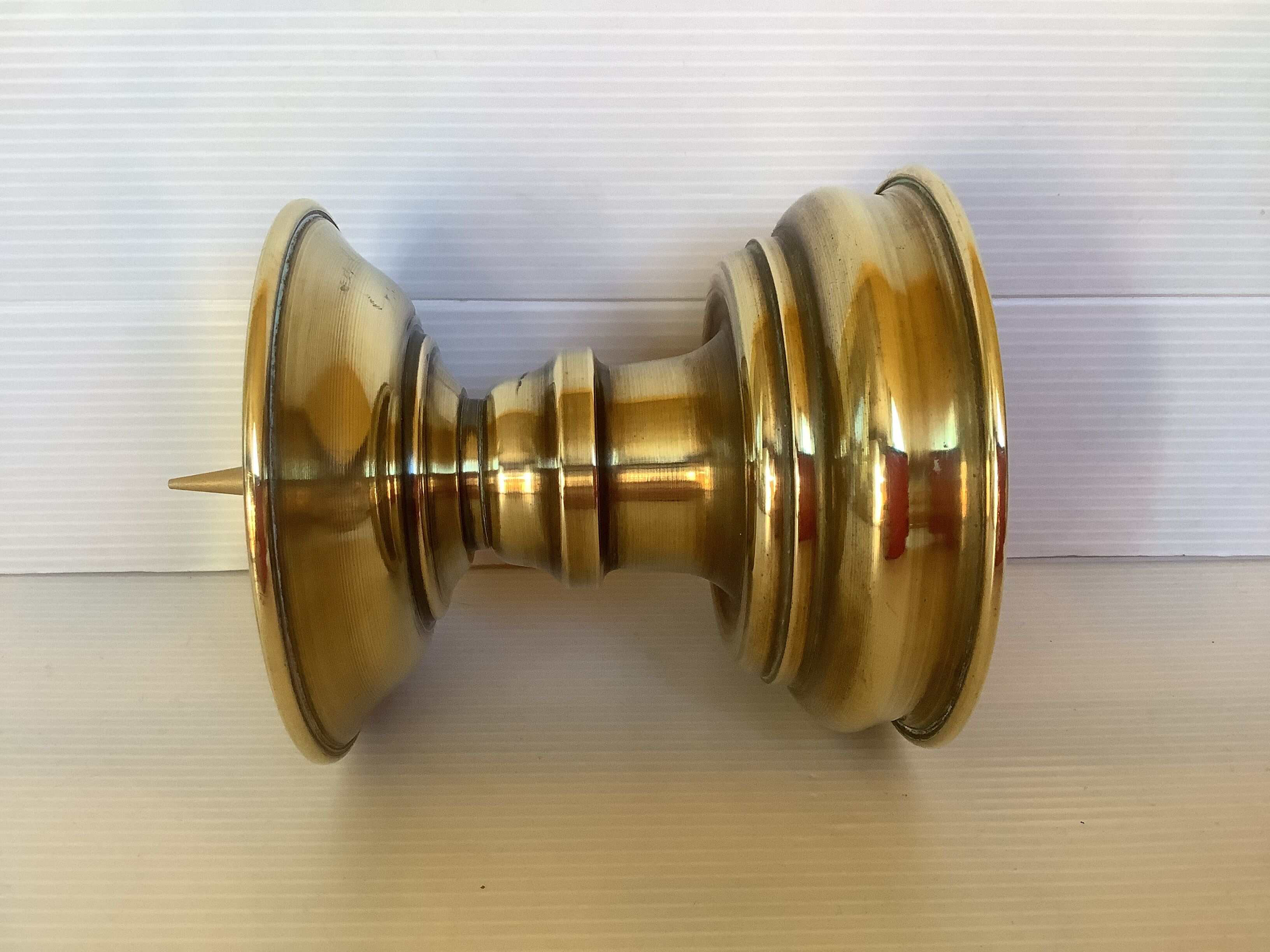 Old brass candle pique