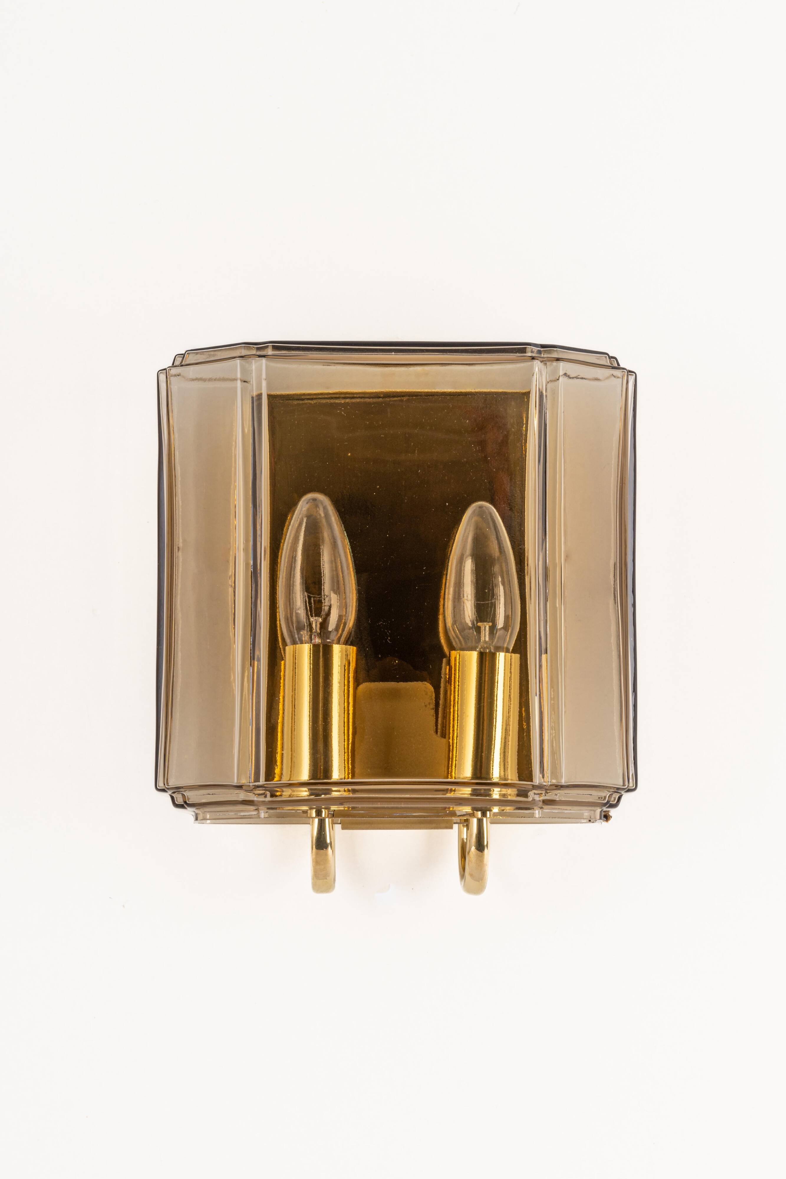 Large smoked glass wall sconces by Limburg, Germany.