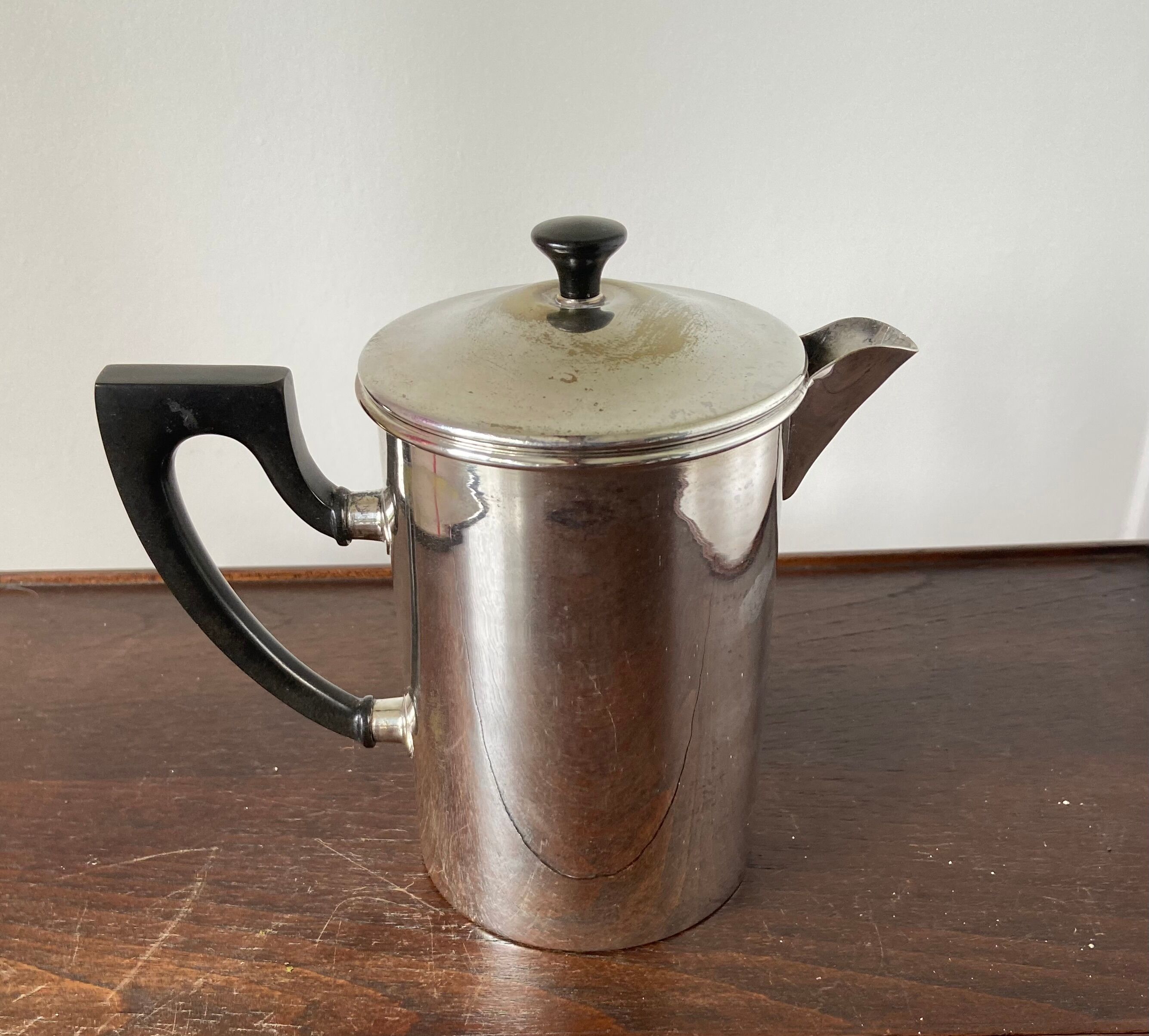 Old silver metal piston coffee maker