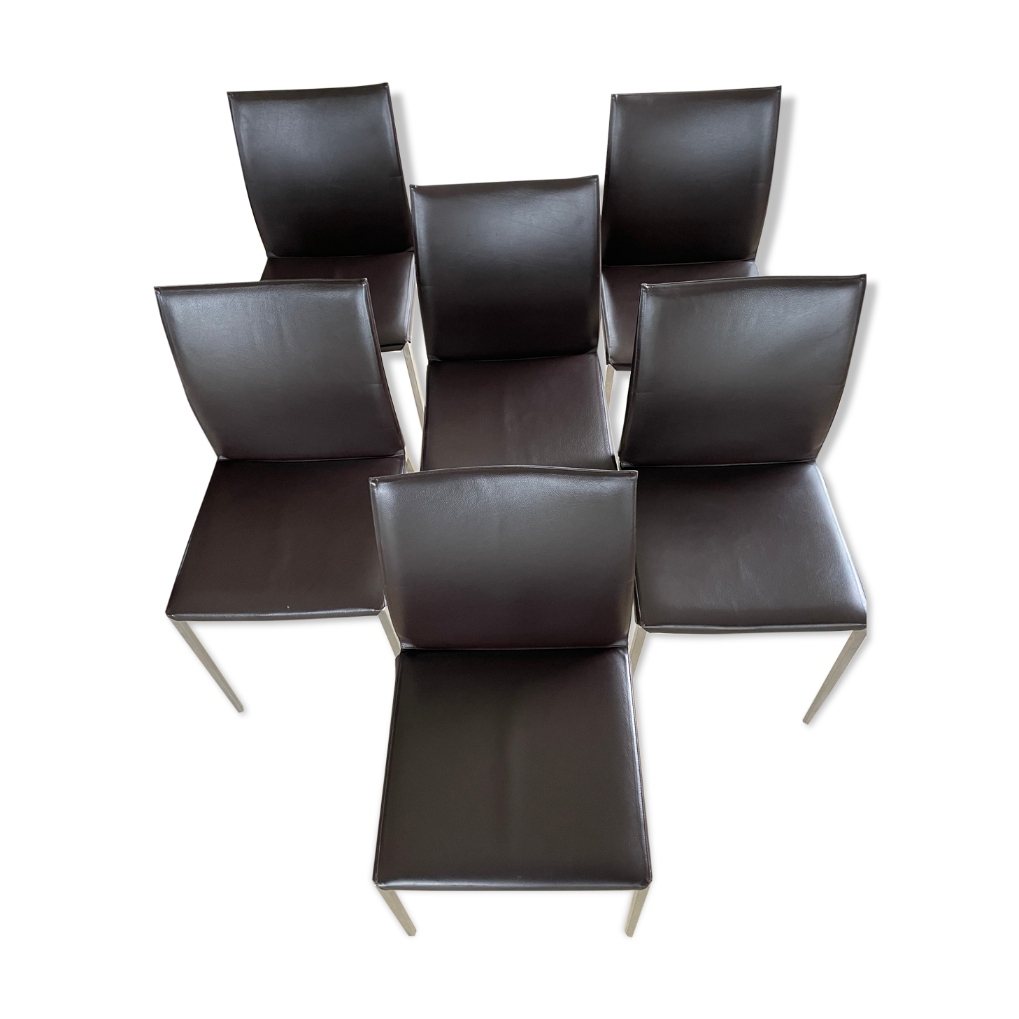 Brown leather chairs and Zanotta metal legs