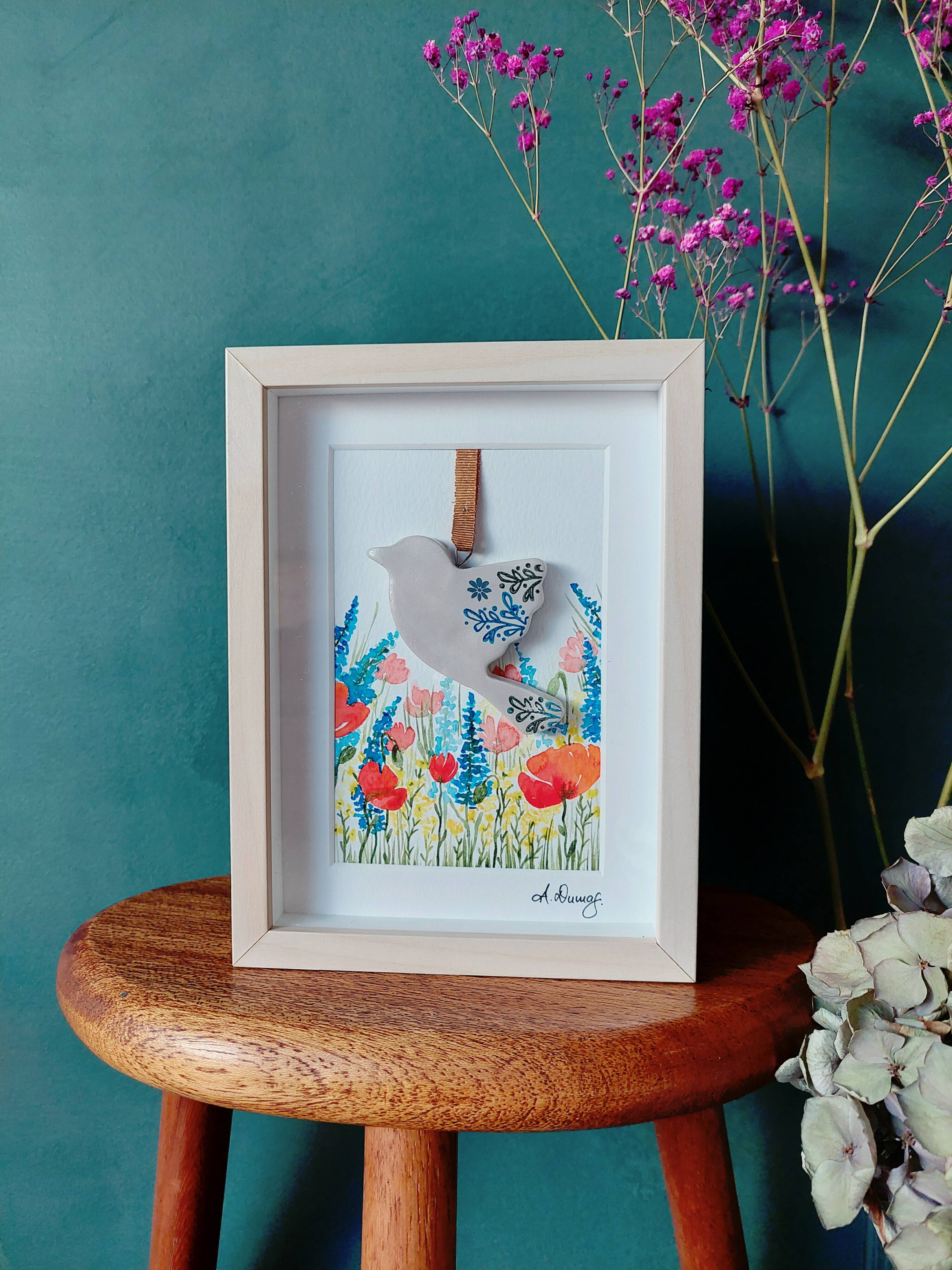 Floral watercolor composition and handmade clay bird