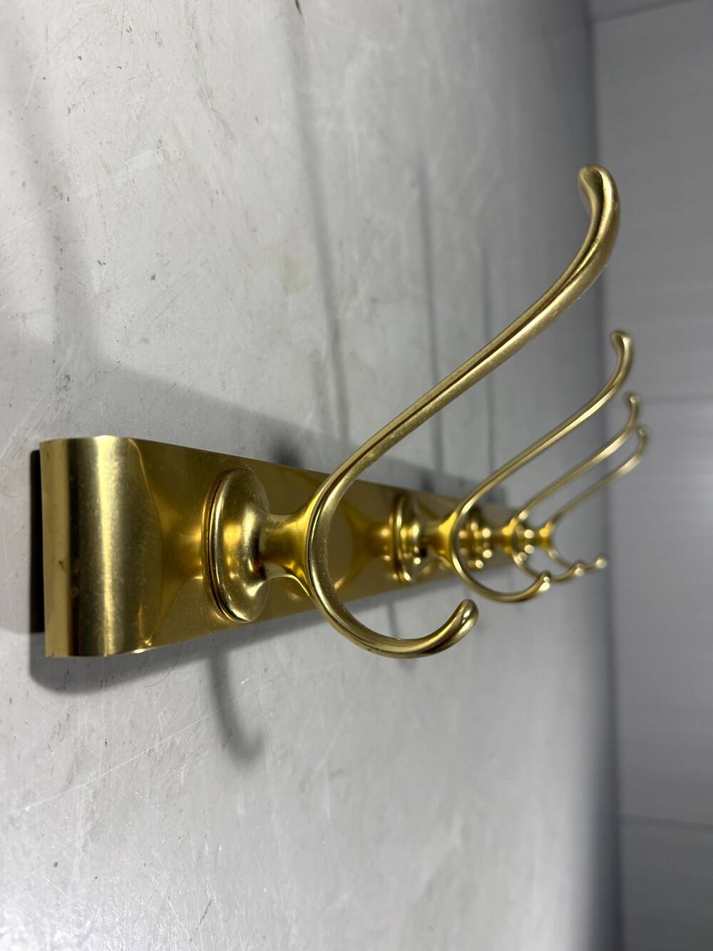 Gold coloured aluminium wall coat rack 1960’s