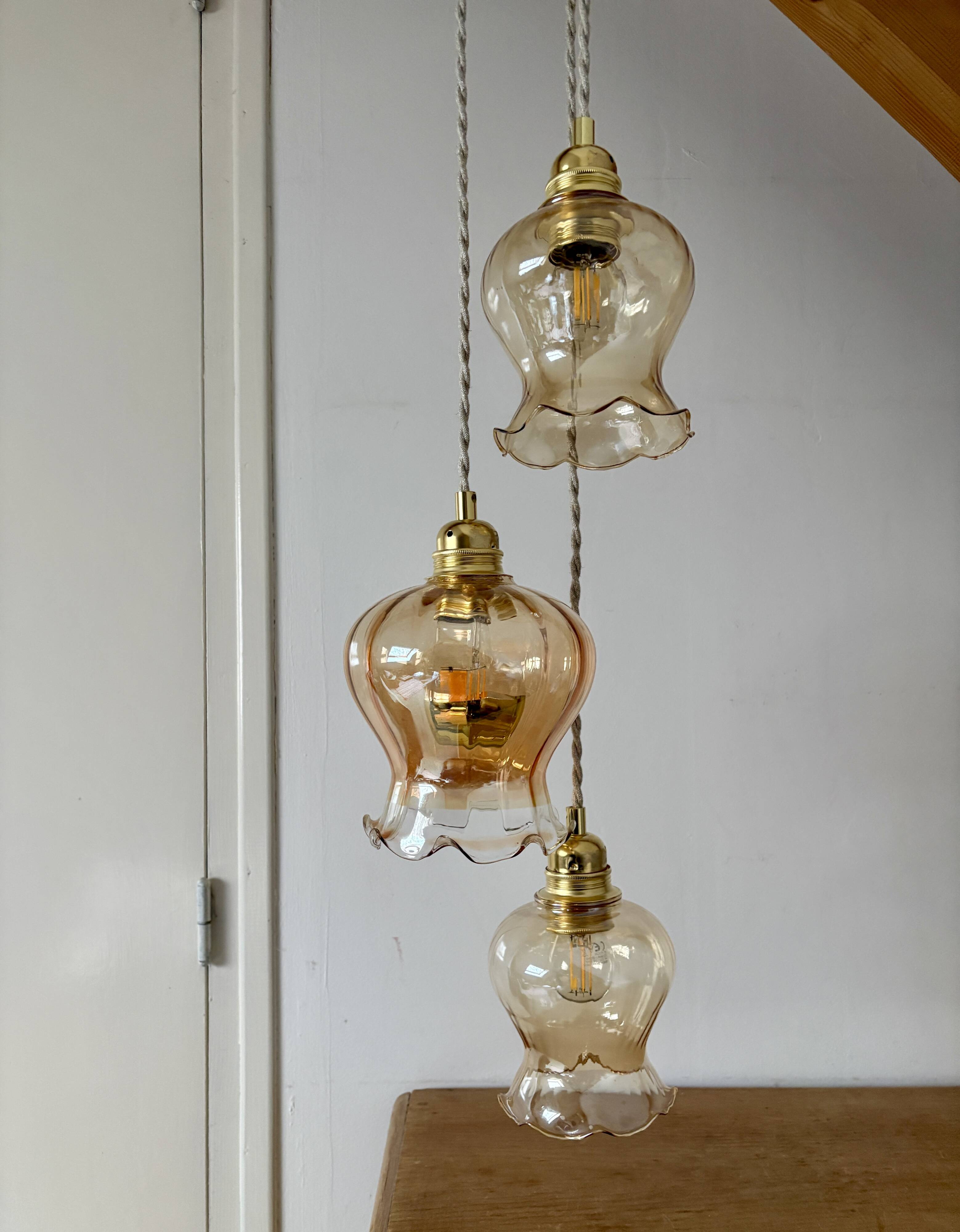 Triple vintage tulip pendant light in amber glass