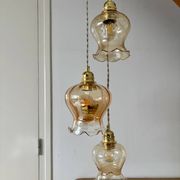 Triple vintage tulip pendant light in amber glass