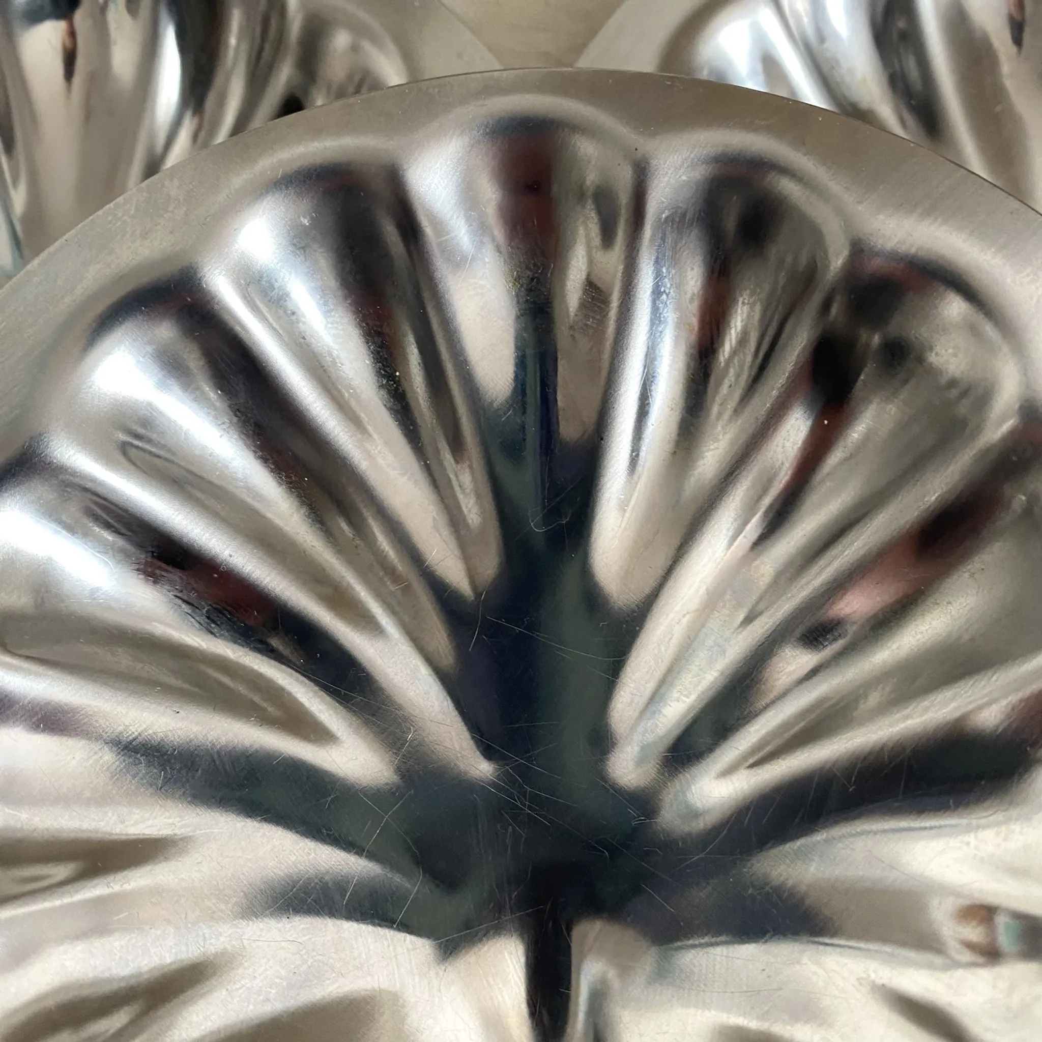 Set of 12 stainless steel scallop shells, 1970s-80s.