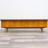 1950s low sideboard in ash, black formica surface. Professionally restored