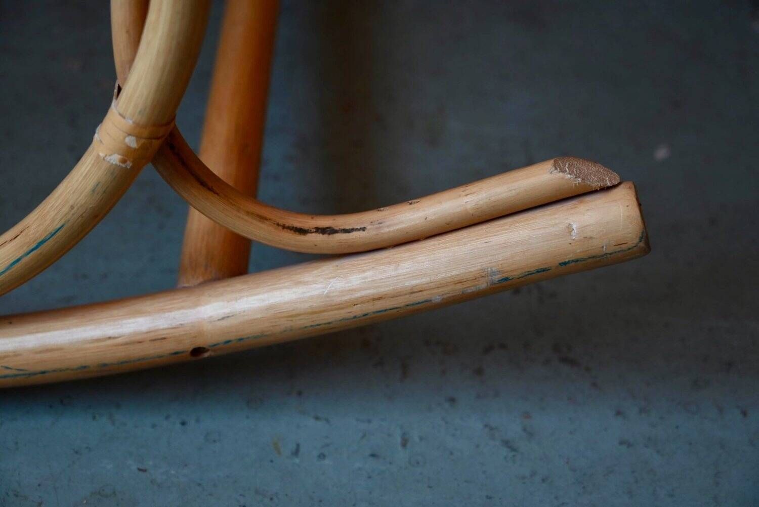 Vintage rocking chair in rattan from the 60s-70s, high openwork backrest.