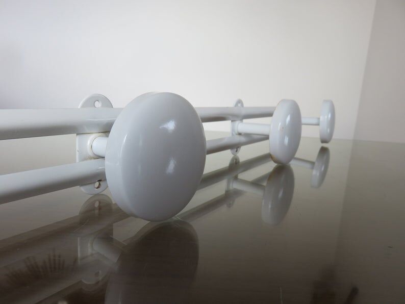 White metal coat holder in 70s