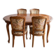 Oval table and 4 chairs in Louis XV style made of wood.