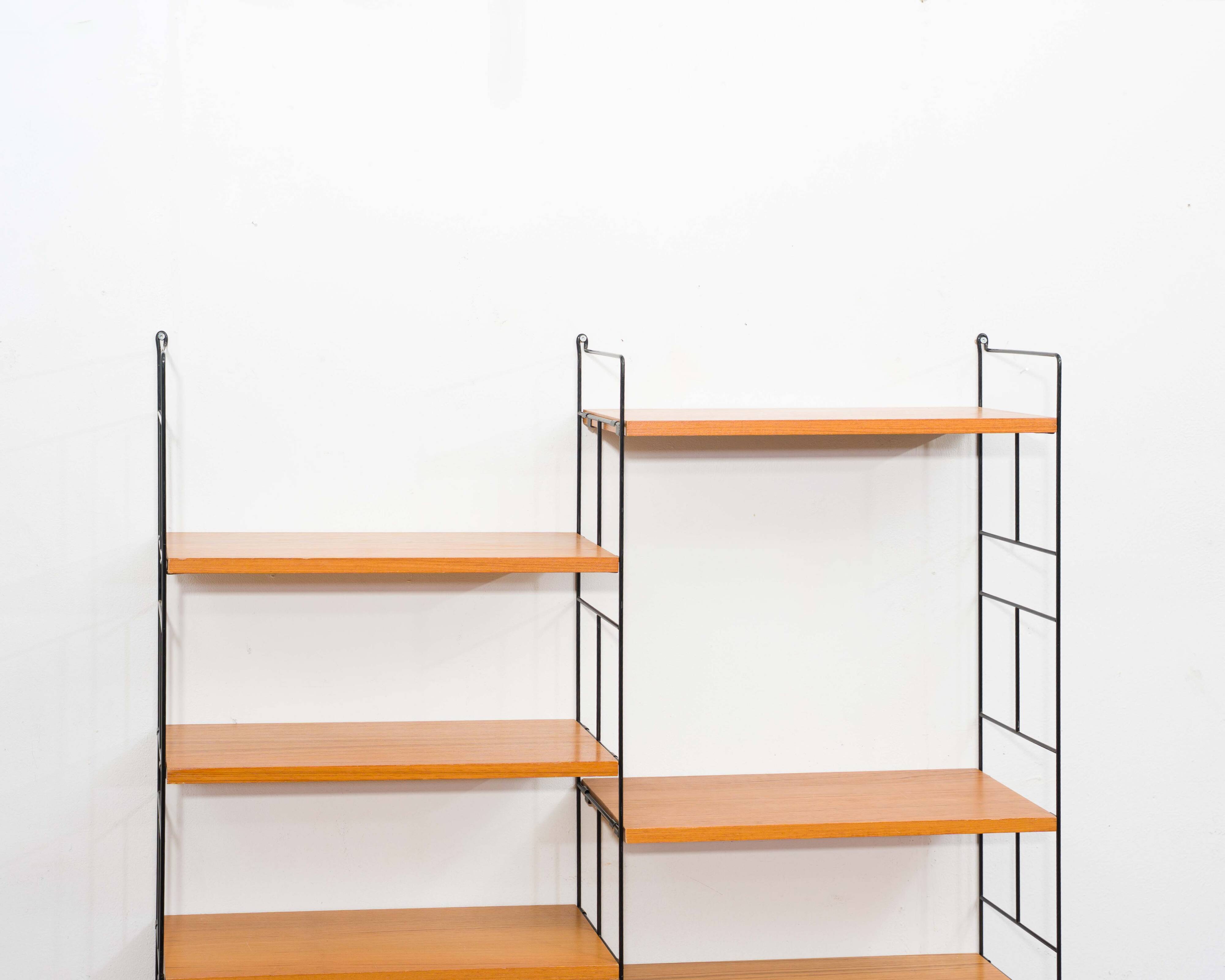 1960s teak wall shelf, manufacturer WHB, eight shelves