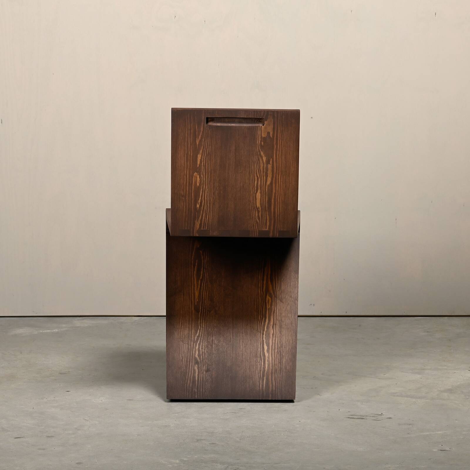 Gerrit Rietveld Zig Zag Chair is dark brown stained wood