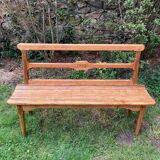 Old wooden bench with backrest, dated 1923