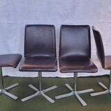 Set of 4 metal and imitation leather swivel chairs.