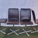 Set of 4 metal and imitation leather swivel chairs.