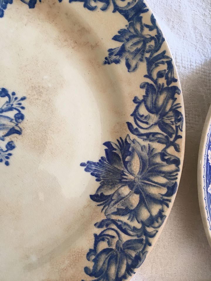 Together seven dessert plates mismatched in blue.