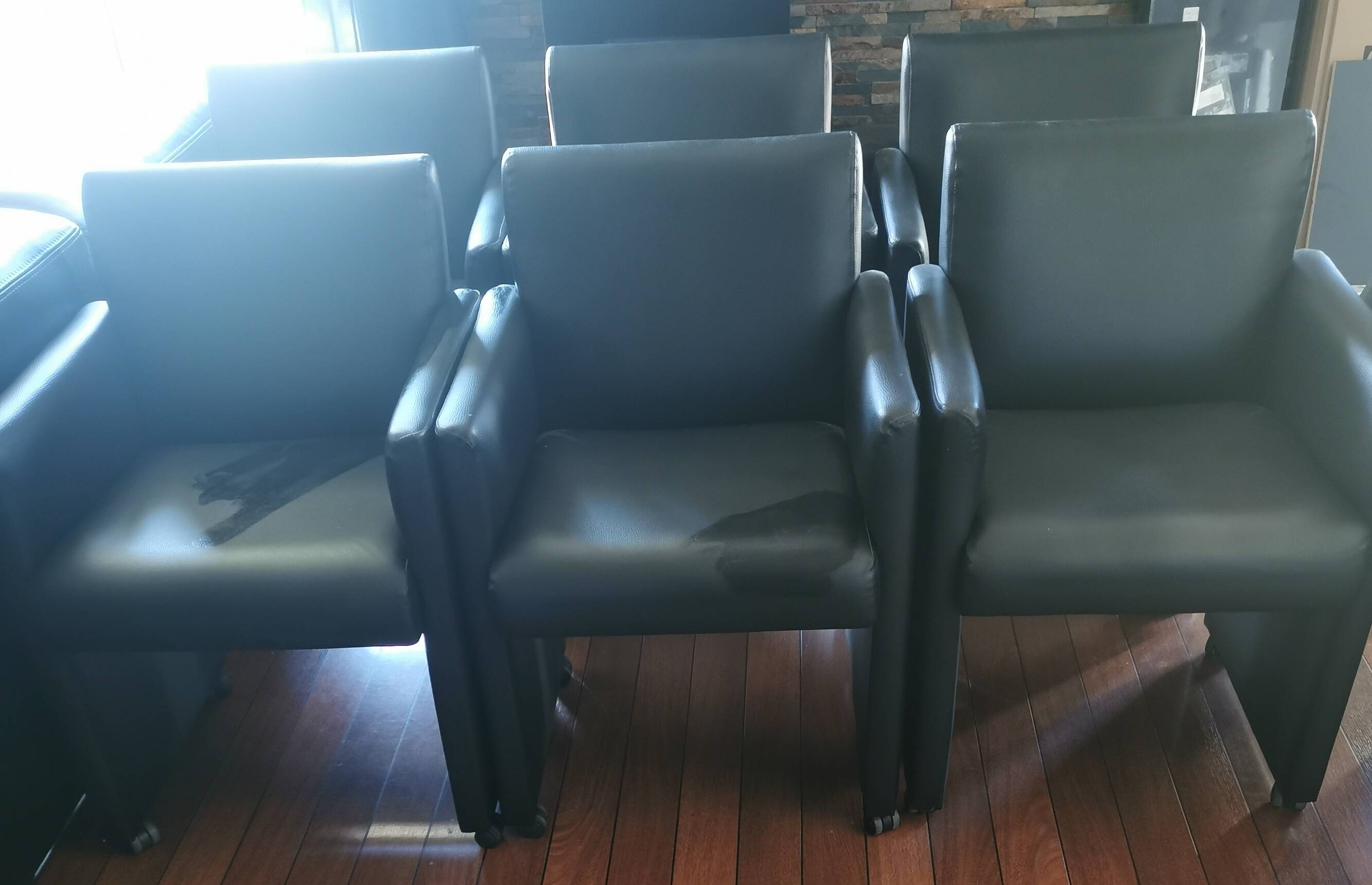 6 faux leather chairs on wheels