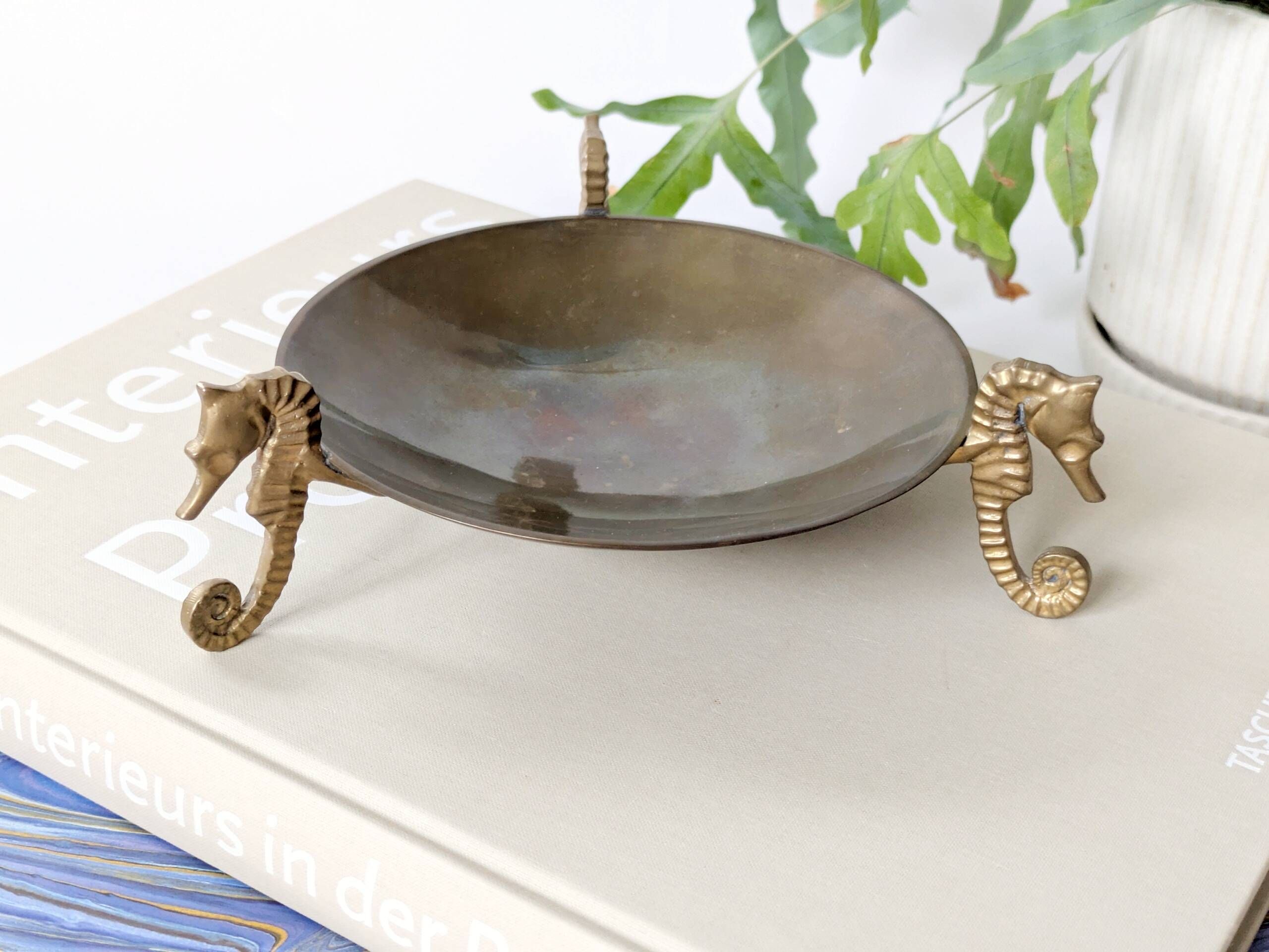 Vintage round brass tray on seahorse feet