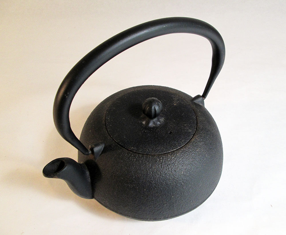 Black cast iron teapot