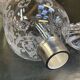 Baccarat crystal lantern with engraved foliage decoration.
