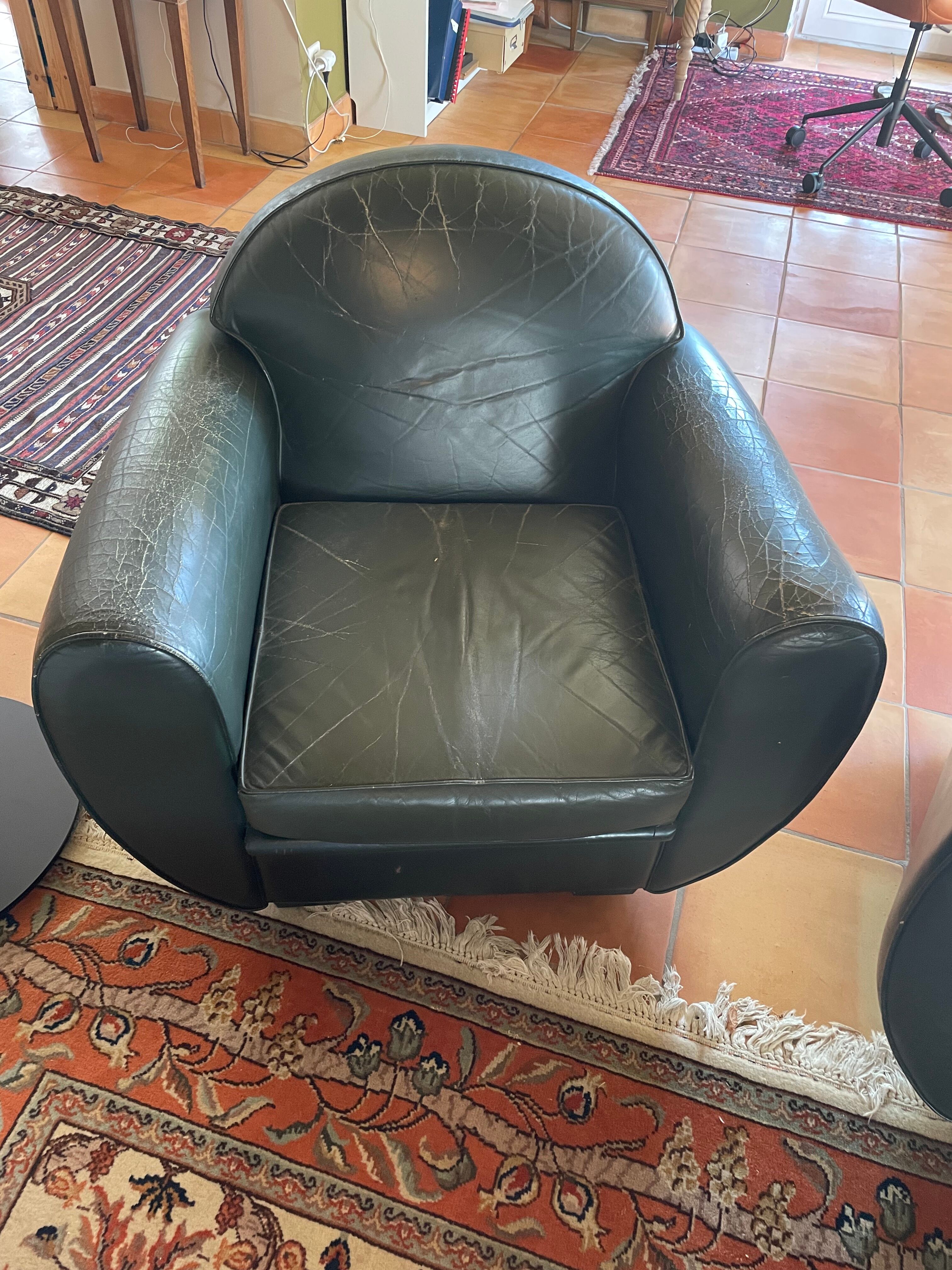 Green leather club chairs