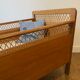 Wooden and wicker baby bed