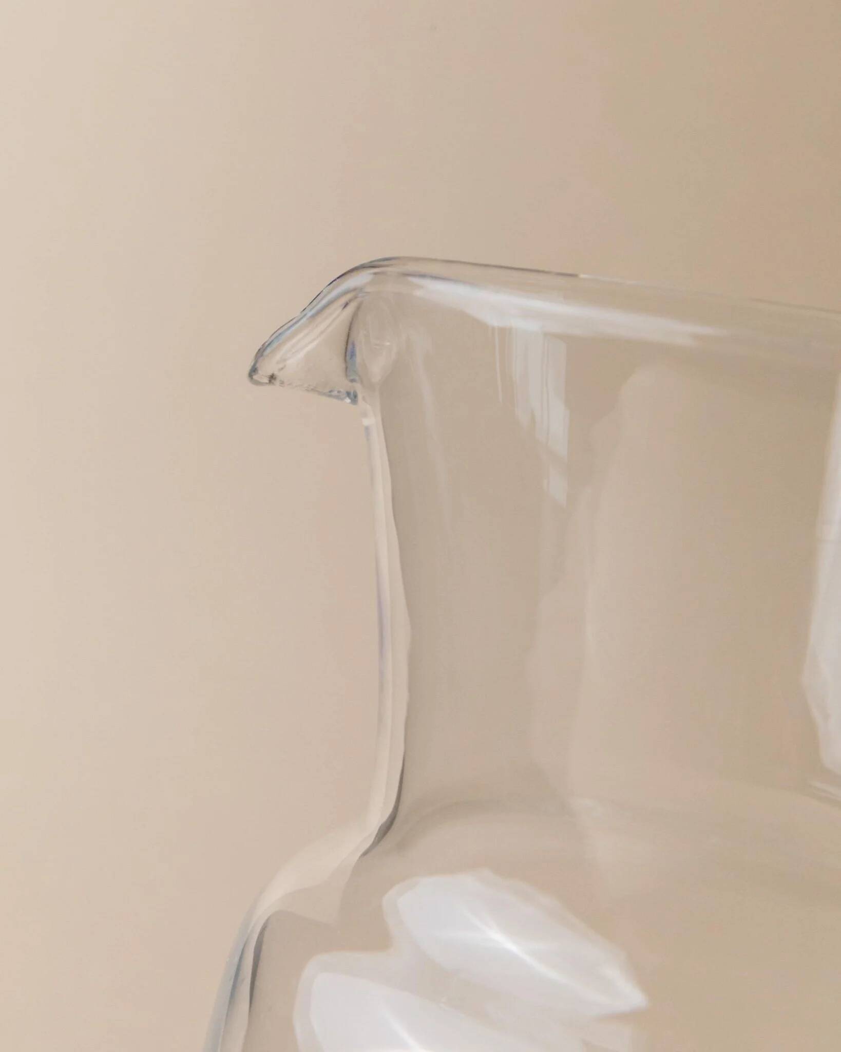 Vintage glass pitcher - clear glass with blue handle - Mid-Century design from Italy in the 1970s - elegant table decoration, retro gift idea.