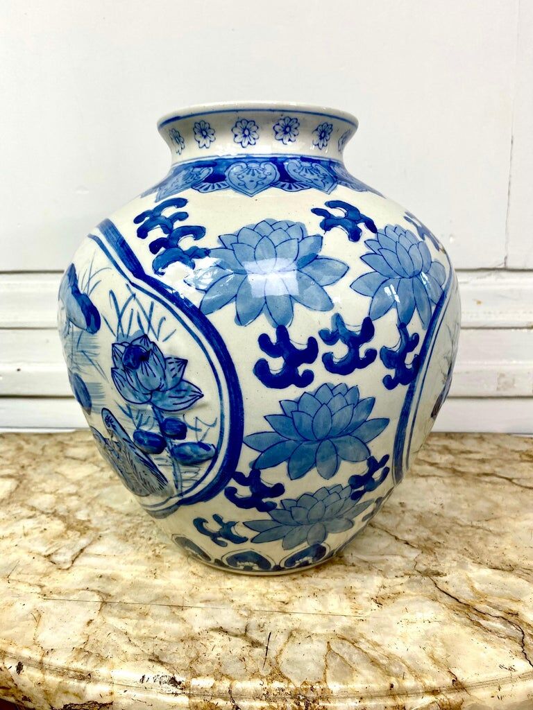 Chinese vase in blue-white porcelain decorated with lotus flowers