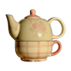 Vintage porcelain teapot and cup set with pink and beige floral and gingham pattern